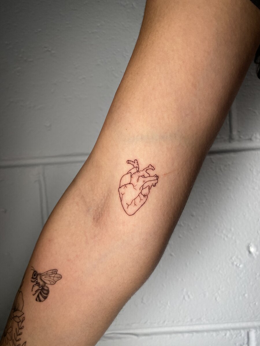 Delicate fine line flower tattoo Gold Coast custom piece